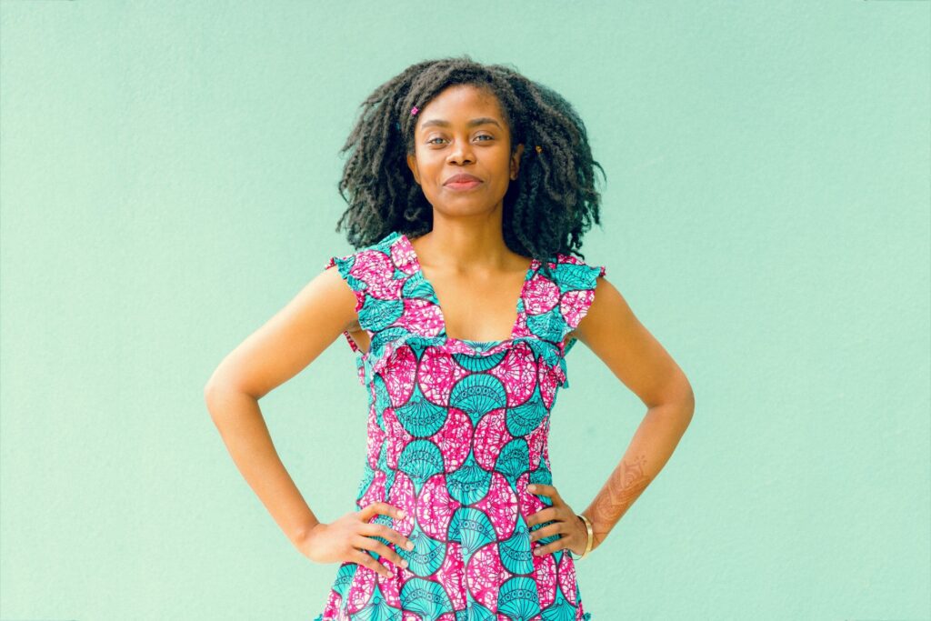 woman in teal and pink dress