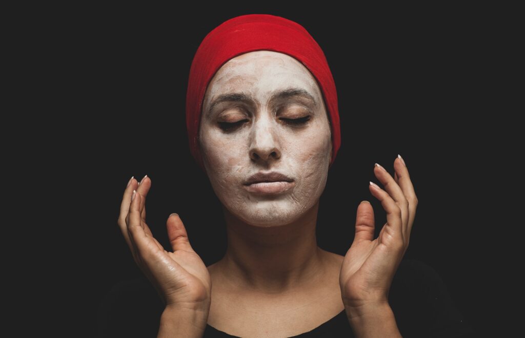 Woman using gentle exfoliating face mask