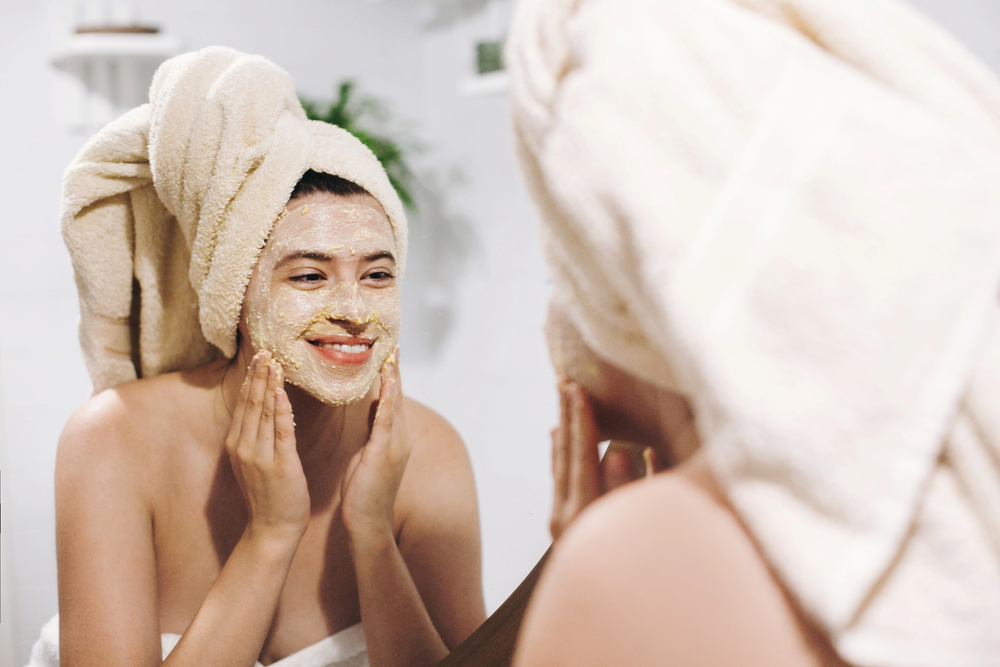 woman using facial scrub