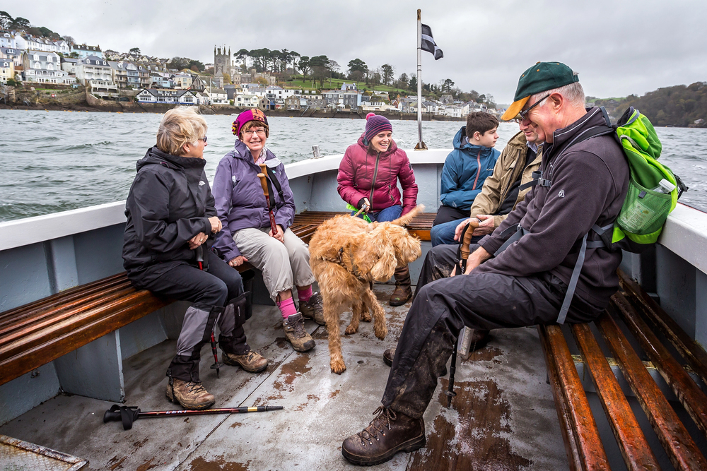 multigenerational family travelling by boat in cornwall